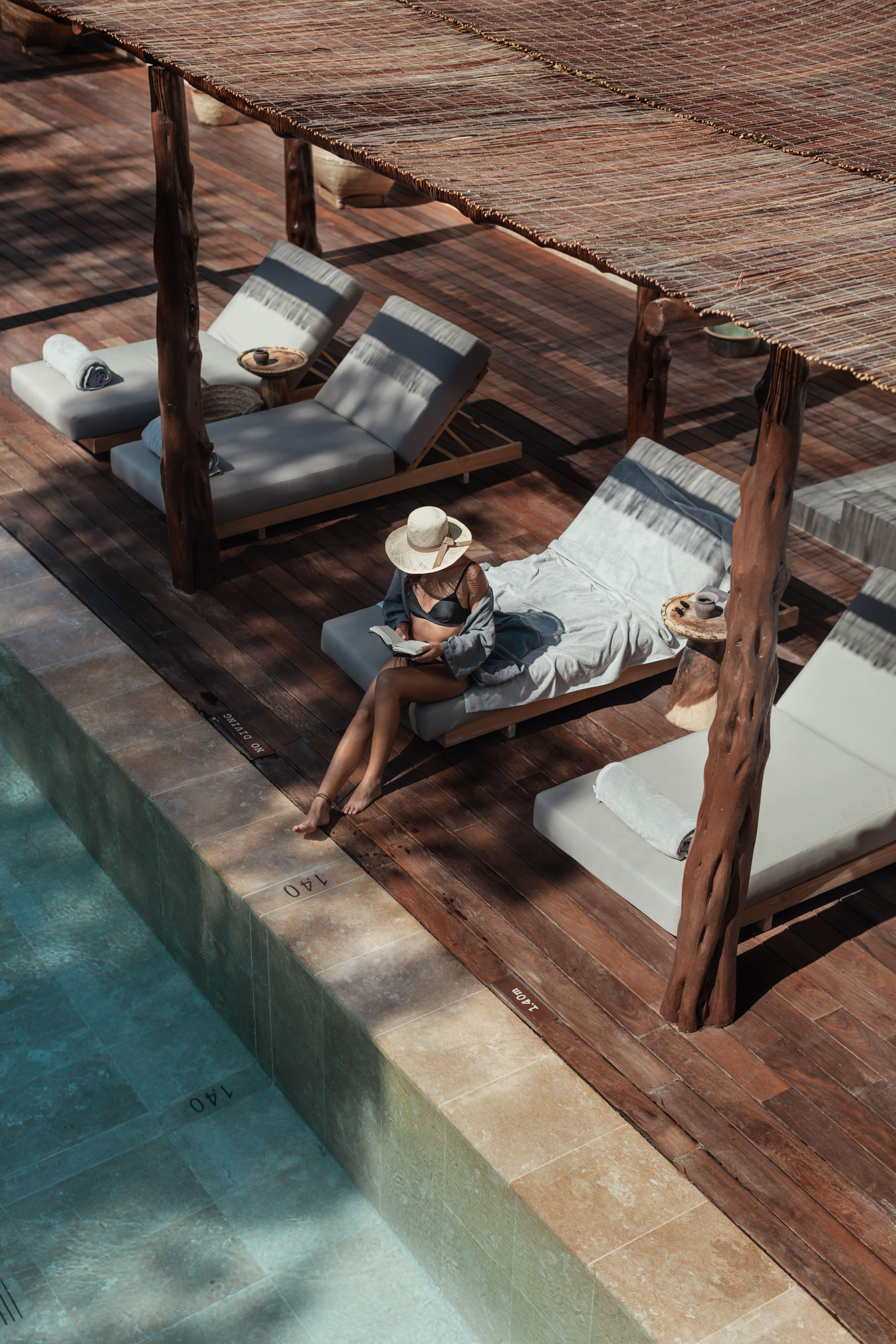 Oku Ibiza (Adults Only) Hotel San Antonio Kültér fotó A woman relaxing at a resort